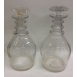 A pair of Georgian fluted decanters with tapering