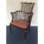 An Edwardian mahogany chair with tapestry seat. Es