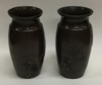 A pair of Japanese Shakudō vases of baluster form.