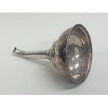 A Georgian silver wine funnel with reeded border.