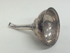 A Georgian silver wine funnel with reeded border.