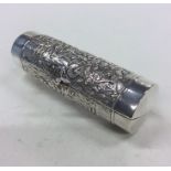 An unusual cylindrical silver purse decorated with