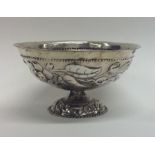A Dutch silver sugar bowl decorated with flowers a
