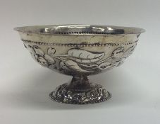 A Dutch silver sugar bowl decorated with flowers a