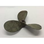 A heavy cast iron three blade propeller. Est. £25