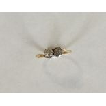 An 18 carat diamond two stone crossover ring. Appr