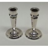 A pair of heavy cast silver Danish candlesticks of