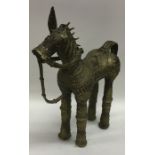 A Continental brass mounted model of a horse with