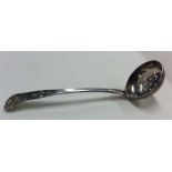 A Scottish Victorian silver sifter spoon with shel