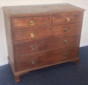 A Georgian oak chest of three long and two short d