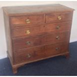 A Georgian oak chest of three long and two short d