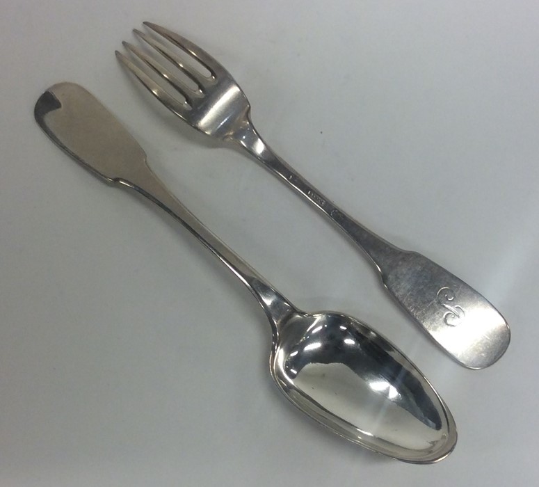 A French silver fiddle pattern fork together with