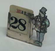 A novelty silver calendar in the form a gentleman