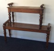 A Victorian mahogany window seat on turned taperin