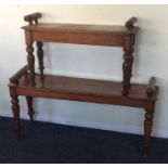 A Victorian mahogany window seat on turned taperin