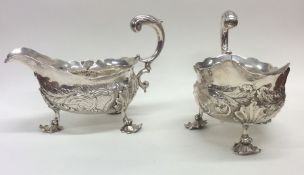 A good pair of Georgian embossed silver sauce boat