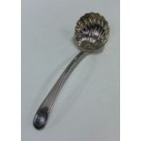A Georgian bottom marked silver ladle with fluted