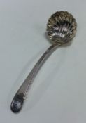 A Georgian bottom marked silver ladle with fluted