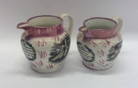 A pair of pink ground Sutherland jugs decorated wi