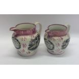 A pair of pink ground Sutherland jugs decorated wi