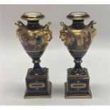 A pair of attractive Vienna vases on square pedest