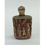 A small Oriental carved scent bottle decorated wit