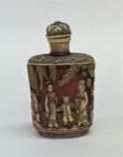 A small Oriental carved scent bottle decorated wit