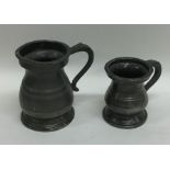 Two pewter miniature baluster shaped tankards. Est