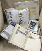 A collection of First Day covers, coins etc. Est.