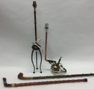 Two copper mounted lamps together with two walking