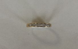 An 18 carat gold diamond seven stone ring in rub o