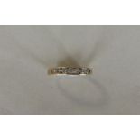 An 18 carat gold diamond seven stone ring in rub o