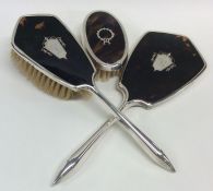 An Edwardian silver and tortoiseshell three piece