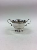 An Edwardian silver sugar bowl on stepped base. Bi