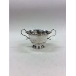 An Edwardian silver sugar bowl on stepped base. Bi