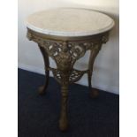 A marble top cast iron pub table of typical design