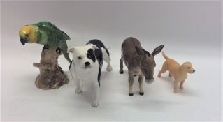 A Beswick figure of a Donkey together with two Bes