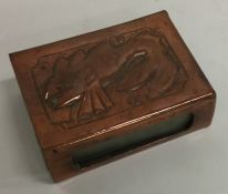 A small copper match case decorated with a fish. E