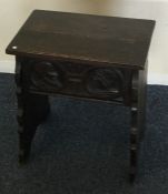 An oak carved and hinged top box. Est. £25 - £35.