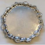 A good circular Georgian silver salver with creste