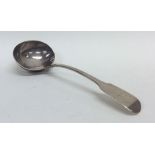 A fiddle pattern silver sauce ladle. London. Appro