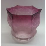 A hexagonal cranberry glass lampshade decorated wi