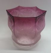 A hexagonal cranberry glass lampshade decorated wi