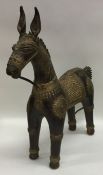 A Continental brass mounted model of a horse with