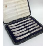 A boxed set of six silver handles tea knives. Est.