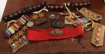 A set of dress medals together with cap badges etc