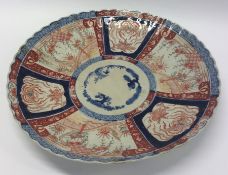 A large Imari charger with wavy edge. Approx. 41 c