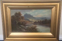 FRANK HIDER (1861 - 1933): A gilt framed river lan