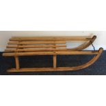 An old wooden sledge. Est. £25 - £35.