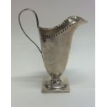 An Edwardian Georgian style silver cream jug on sq